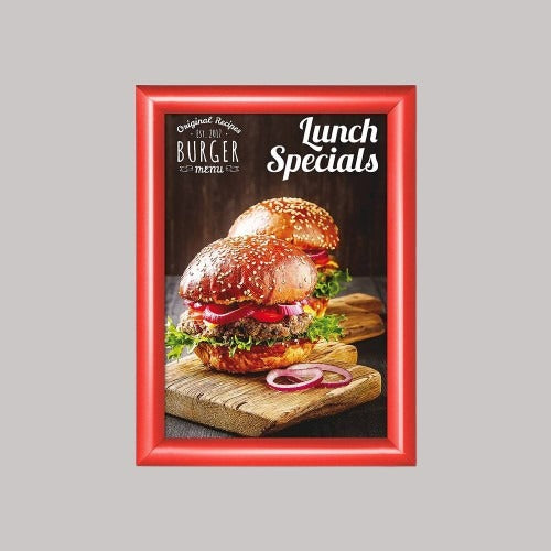 A red snap frame displaying a poster of a sandwich, with the text 'Lunch Specials' on it, set against a plain background.