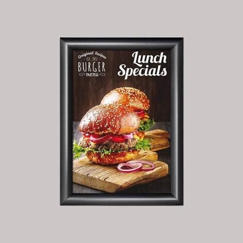 A snap frame displaying a poster of a sandwich, with the text 'Lunch Specials' on it, set against a plain background.