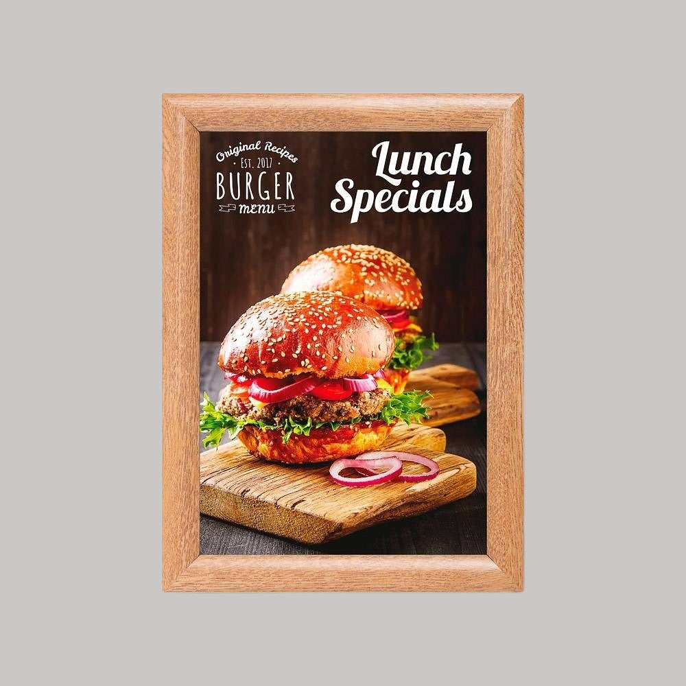 A wood snap frame displaying a poster of a sandwich, with the text 'Lunch Specials' on it, set against a plain background.