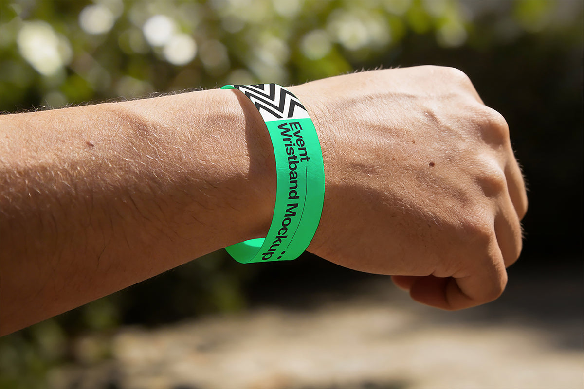 Green Tyvek event wristband worn on a wrist for attendee identification