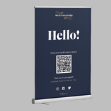 Navy blue personalised pull up banner with Hello message and QR code on a retractable exhibition display stand