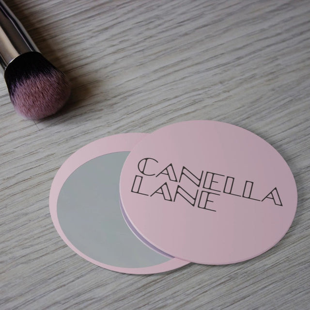 Promotional makeup mirror with sliding design