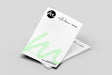 Two white printed a5 letterheads with green text on a grey background